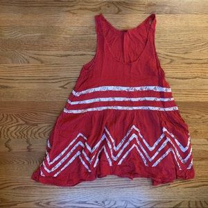 Red sleeveless tunic length white polka dots and lace. Thin material